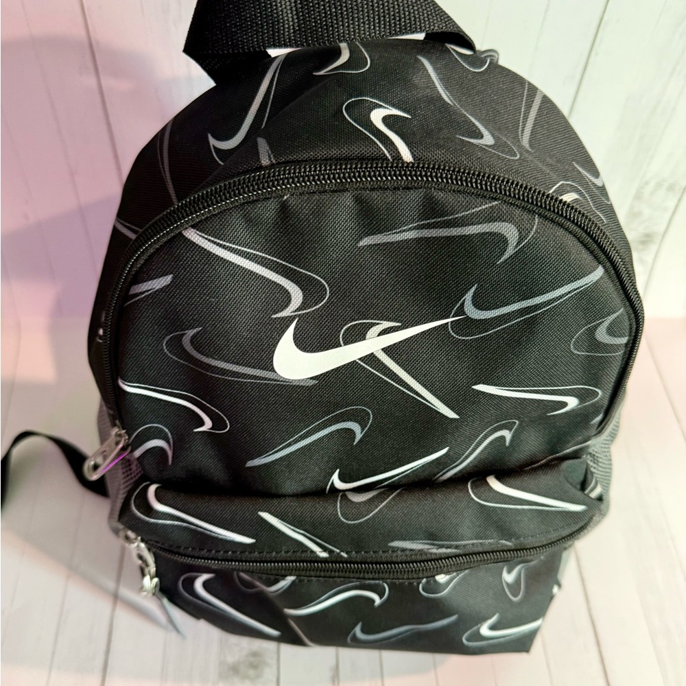 Nike Black and White Backpack with Iconic Swoosh Design